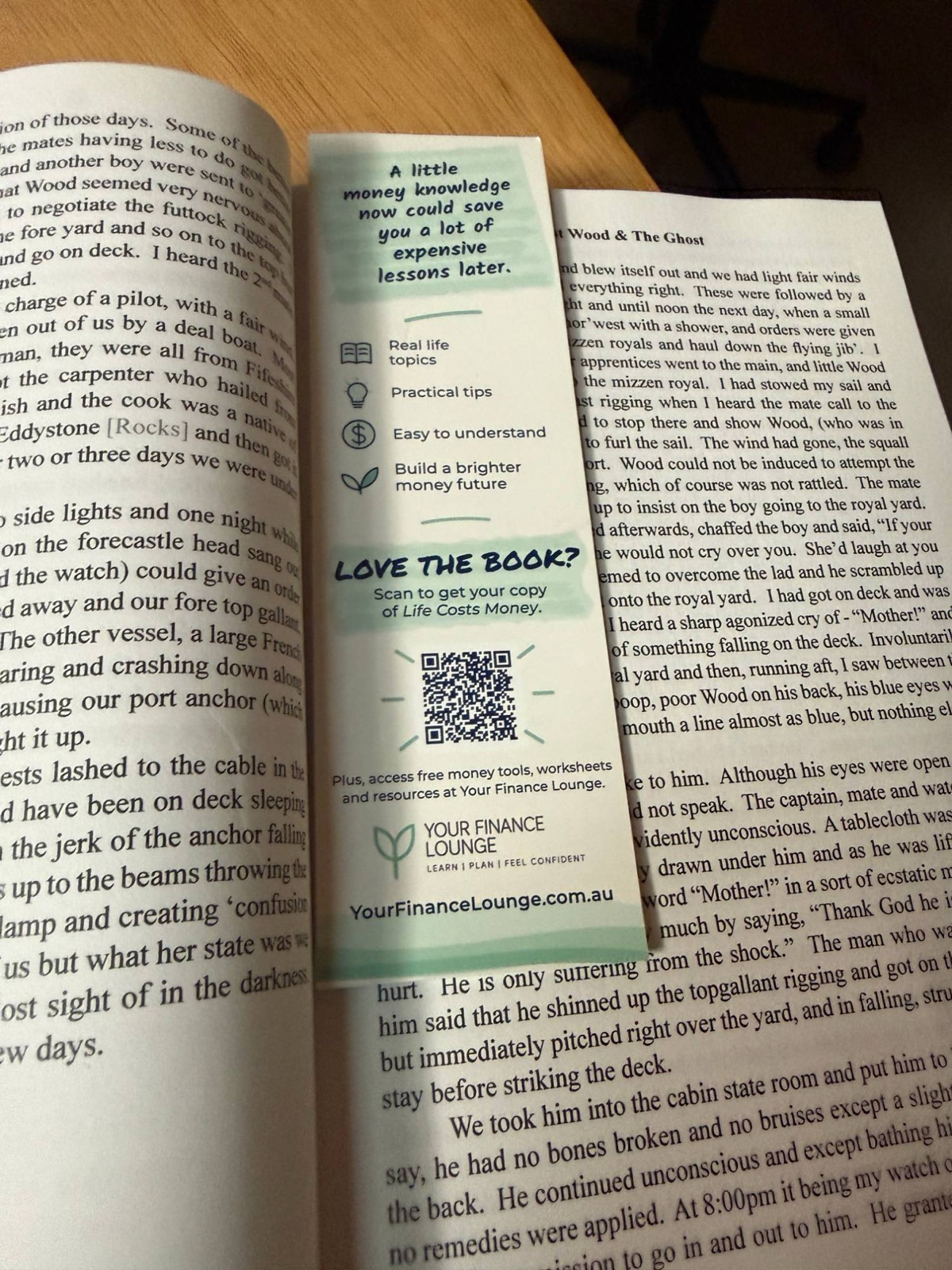 Back of the Life Costs Money bookmark showing the tagline, feature list, Love the book QR code and the Your Finance Lounge logo
