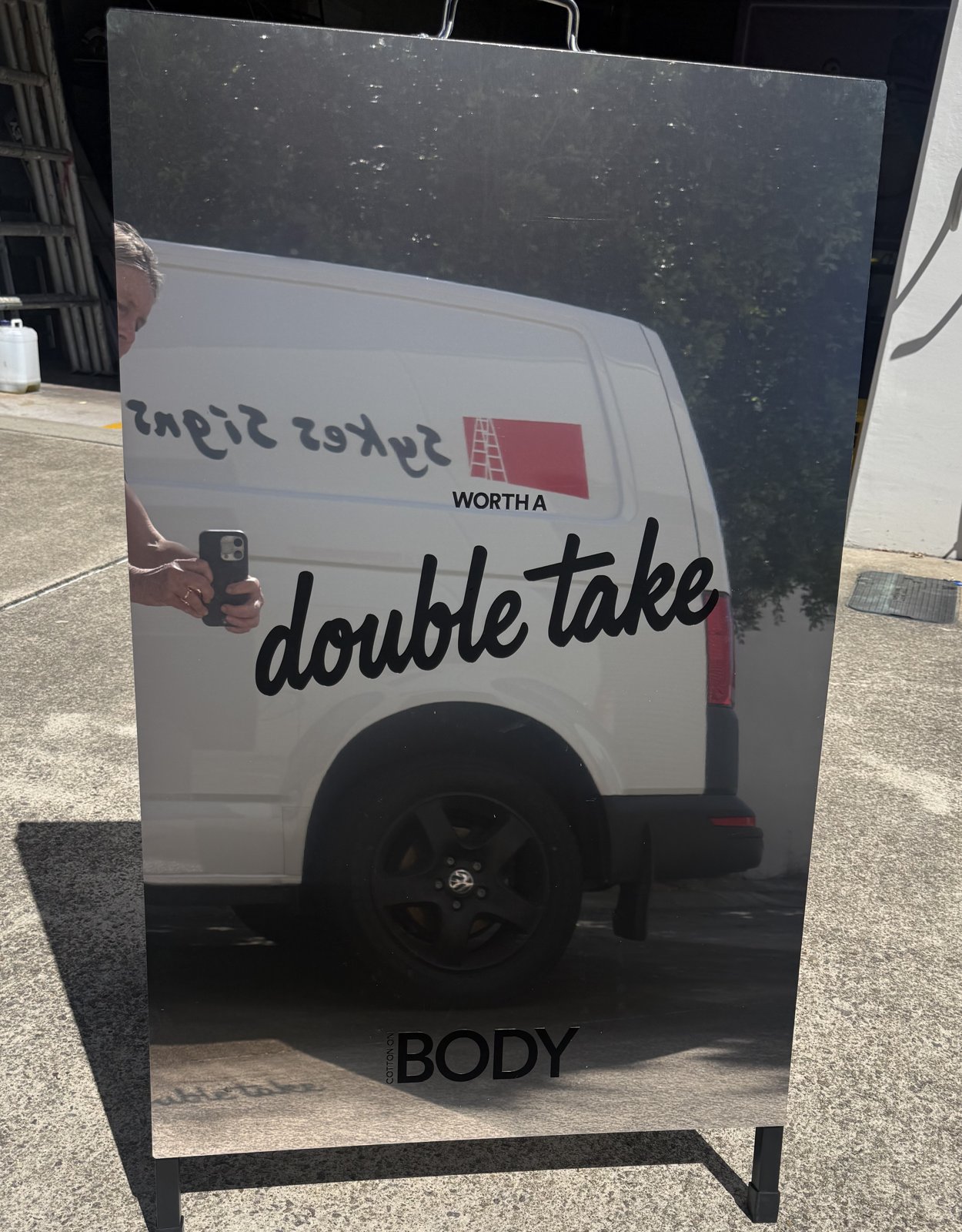 Cotton On Body mirror finish A-frame sign reading 'Worth a double take', made by Sykes Signs